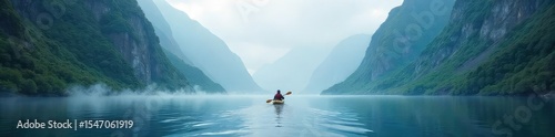 A lone kayak navigates a serene, mist-shrouded fjord, mountains rising dramatically in the background The scene evokes a sense of peaceful exploration and wilderness adventure , journey, peaceful