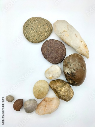Rocks on a white background, Zen rock art that expresses beauty and tranquility. To understand the beauty of Japanese gardens, you must first understand the beauty of rocks and stones. photo
