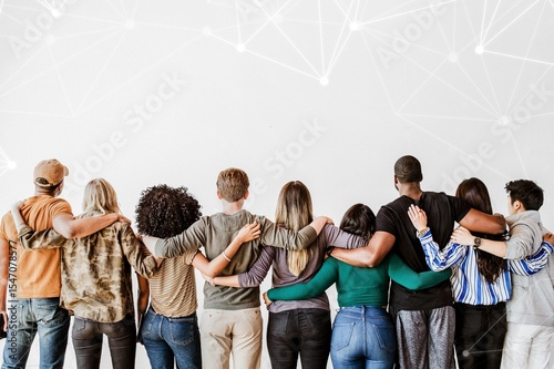 Rearview of diverse people hugging each other