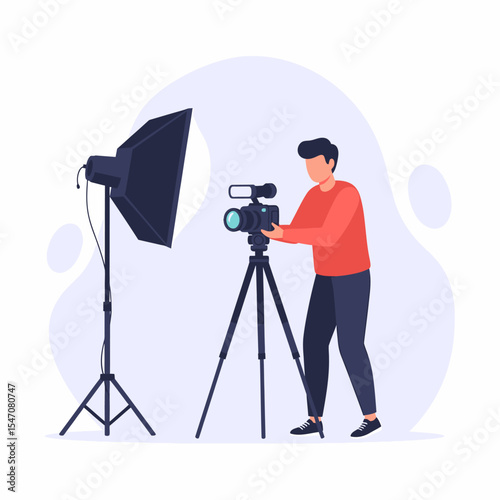 Professional Photographer with Video Camera in Studio Lighting Setup