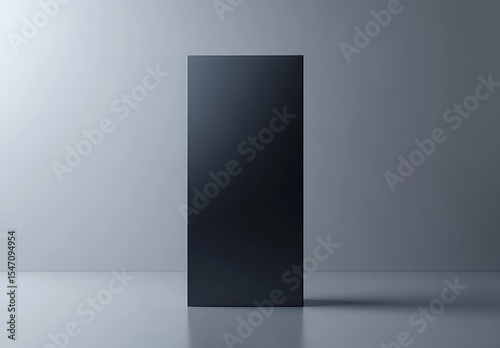 Monolith mockup on smooth surface with soft gray lighting

