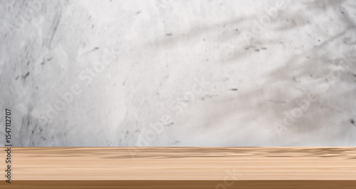 Empty wooden surface with a grey concrete-textured wall and soft shadow, creating a minimalist natural backdrop. Perfect for product displays in rustic, industrial, and modern styles, Showcasing items