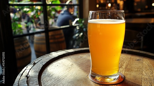 Bire de garde specialty glass soft lighting highlighting golden amber color wooden barrel table 50mm lens northern French brasserie