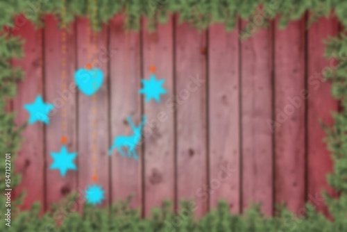 Blurred fir tree branches on wood