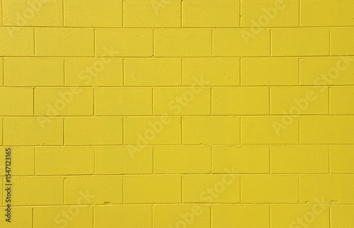 Yellow brick wall close-up abstract textured background