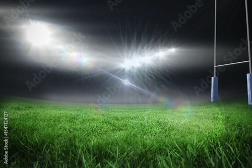 Floodlights are illuminating grassy pitch under night sky with rugby goalposts in flat design