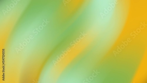 Abstract blurry yellow and green background suitable for websites, presentations, designs, and marketing campaigns requiring a vibrant and energetic feel