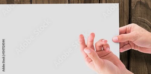 Cropped hands gesturing against white paper