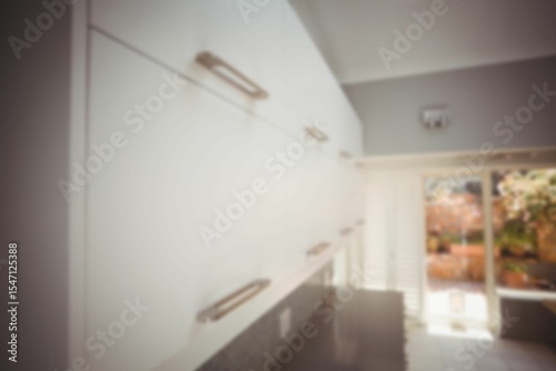 Defocused image of cabinets in kitchen