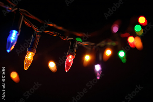 a string of christmas lights with colored lights