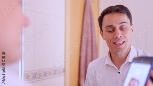 Insecure office worker taking selfies in bathroom mirror