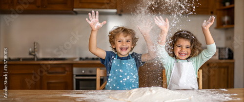 Two happy children playing with flour in a kitchen, joyful baking. Their faces and the wooden table are covered in flour, evoking feelings of joy and fun.