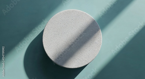 Minimalist Stone Pedestal on Soft Teal-Blue Background for Product Display