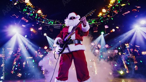 Santa Claus performing live with electric guitar under stage spotlights and Christmas decorations, representing holiday rock concert, winter celebration, and festive family entertainment