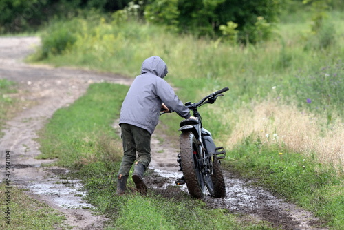 Boy riding a fatbike on a dirt road