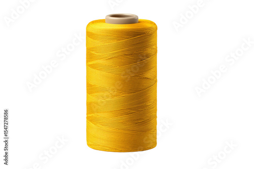 A yellow spool of thread is sitting on a white background
