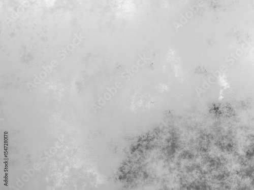 Moody grunge texture with complex dark and light areas blending into a metallic surface.