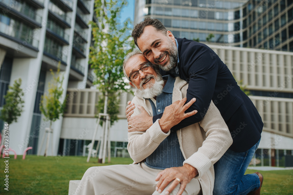 Fototapeta premium Father and adult son sitting on bench in park, sharing peaceful moment.