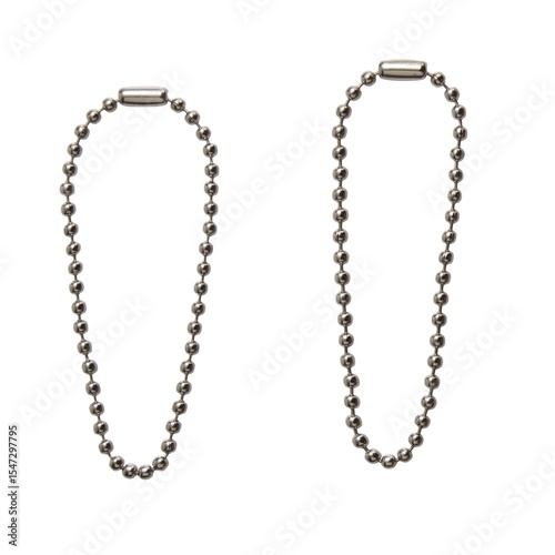 Silver ball chains on white background, metal bead necklace