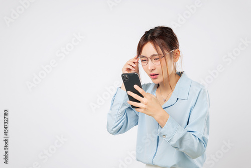 Принти на полотні Vision blurred with screen use, problem woman holding glasses, vision loss and bad eyesight affect sight while looking at phone
