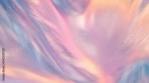 Abstract pastel waves with smooth textures in shades of pink, blue, and lavender. The scene conveys a sense of fluidity and softness.