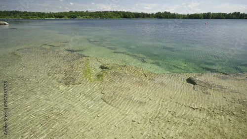 Beautiful nature, landmark of Estonia. Summer season. Rummu quarry lake with clear bright water. Abandoned flagstone quarry.