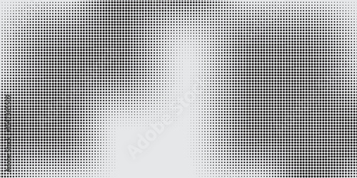 Monochrome Halftone Grid Effect with Light Center and Dark Corners Texture.
