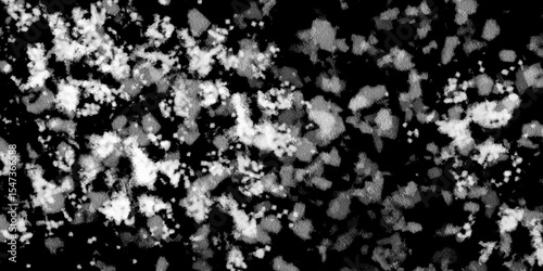Snowflakes on dark background. white icy snowflakes isolated on black background, natural background. white crystalline powder on a black background. sugar dust. texture, pattern and clipping.