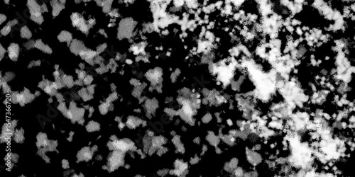 Snowflakes on dark background. white icy snowflakes isolated on black background, natural background. white crystalline powder on a black background. sugar dust. texture, pattern and clipping.