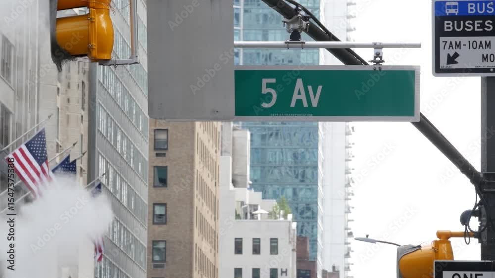 Fifth avenue, 5 ave road sign, Manhattan midtown architecture, New York City 5th av street corner. Traffic crossroad signage, USA. American flag, United States. Steam vapor stack, hot vapour smoke.