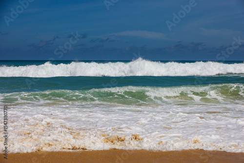 Foamy waves of sea sandy beach, storm on empty coast