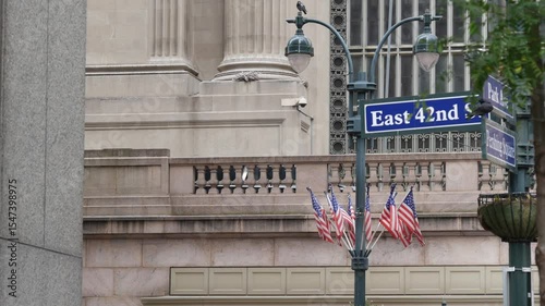New York City Grand Central Terminal, 42 street, Park Avenue, Pershing Square architecture. Midtown district railroad hub, railway transport. NY crossroad corner, intersection road sign, american flag