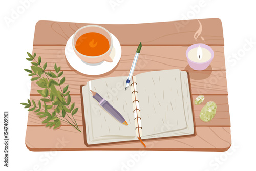Cozy workspace open notebook tea candle pens
