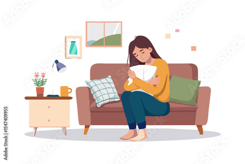 Sad woman sitting on sofa holding pillow at home