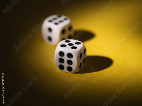Black and white dice on yellow background