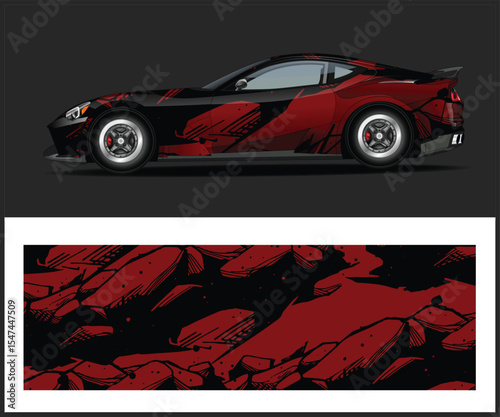 Sleek Black and Red Sports Car with Abstract Graphic Wrap Design