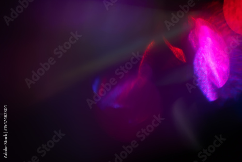 Colorful glow Light flare sparks texture. red orange rays on dark blue abstract overlay