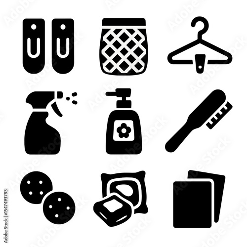 Laundry Accessories Icons. Solid style icons of laundry accessories: sock clips, laundry net, hanger clip, steam spray, odor
