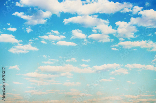 Fototapeta Naklejka Na Ścianę i Meble -  Grunge blue sky and white clouds with vintage effect.