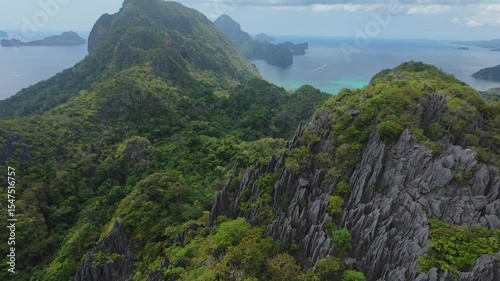 Wallpaper Mural Rare drone view from extreme altitude reveals dramatic karst peaks, dense jungle, and turquoise waters along the El Nido coast. A breathtaking and hardly accessible perspective of Palawan’s wild natur Torontodigital.ca