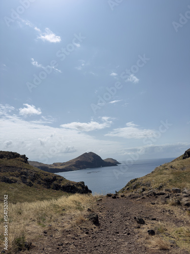 Snapshot from tourist trail on the rocky coast of Ponta de Sao Lourenco Madeira Island. Huge rocks surround small bay, concept of travel.