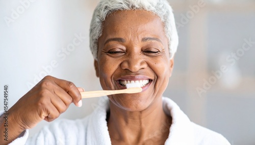 Elderly Woman Brushing Teeth – Daily Wellness and Hygiene Concept