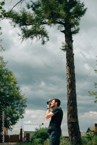 Man with a camera in profile