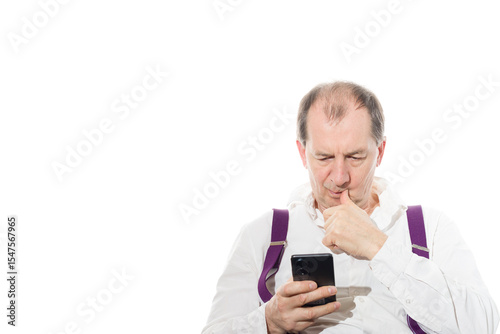 Portrait of a sixty-year-old man in a white shirt.