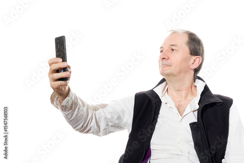 Portrait of a sixty-year-old man in a black vest.