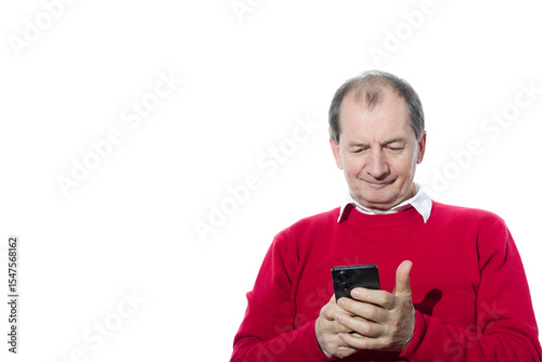 Portrait of a sixty-year-old man in a red pullover.
