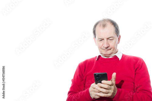 Portrait of a sixty-year-old man in a red pullover.