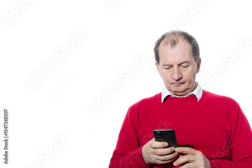 Portrait of a sixty-year-old man in a red pullover.