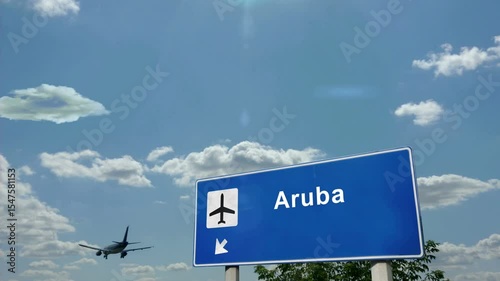 Aruba Caribbean Jet plane landing. City arrival with airport direction sign. Travel, business, tourism and airplane transport concept.