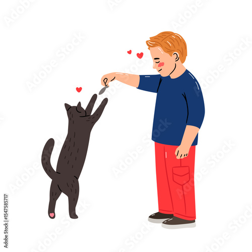 Little boy playing with a cat